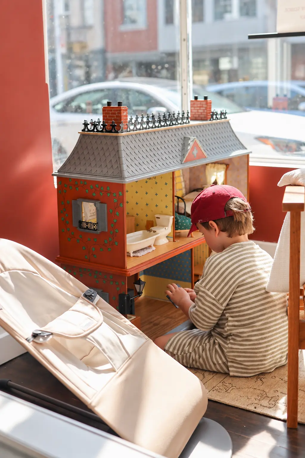 Toddler playing in the kid-friendly corner at Leslieville